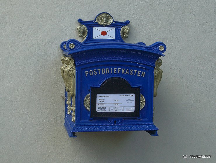 Blue postbox at a building in Frohnau